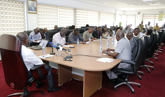 Mr Paul Asare Ansah (head of table) addressing members of the Parliamentary Select Committee on Trade, Industry and Tourism